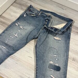 Polo Ralph Lauren The Sullivan Slim Straight distressed jeans patch detailing.